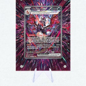 May include: A Charizard EX Pokémon card, displayed on a clear stand. The card features a vibrant illustration of Charizard with fiery wings and a dark background. The card's text includes the name, stage, and abilities.