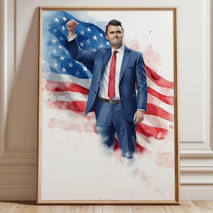 May include: Watercolor painting of a man in a blue suit and red tie with his fist raised, set against a backdrop of the American flag. The artwork is framed in a wooden frame and leans against a white wall and wooden floor.