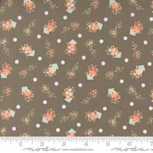 May include: A brown fabric with a repeating pattern of white polka dots, small pink flower clusters, and light blue birdhouses with pink flowers. The fabric is shown with a ruler for scale.