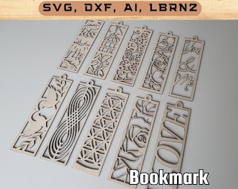 Puede incluir: Un conjunto de 10 diseños de marcapáginas cortados con láser. Los marcapáginas están hechos de madera y presentan varios patrones, incluidos corazones, flores, pájaros y formas geométricas. El texto "OVER" y "Bookmark" es visible en la imagen.