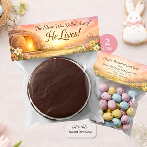 May include: An Easter-themed image featuring a chocolate-covered cookie and a bag of speckled candy eggs. The image includes a banner with the text "The Stone Was Rolled Away! He Lives!" and another banner that says "Happy Resurrection Day!" with a quote.