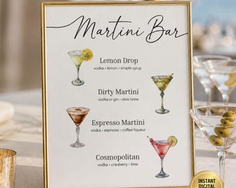 May include: A gold-framed sign titled Martini Bar featuring watercolor illustrations of four cocktails. The menu lists ingredients for a Lemon Drop, Dirty Martini, Espresso Martini, and Cosmopolitan, each with its corresponding drink illustration.