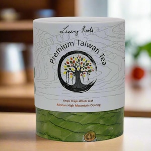 May include: A white cylindrical container with a green and brown design. The container has text that reads "Living Roots Premium Taiwan Tea" and "Single Origin Whole Leaf Alishan High Mountain Oolong".