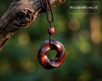 Mobius Wooden Necklace: Hand-Carved Bloodwood Pendant, Infinity Loop Design, Adjustable Cord, Unique Geometric Gift