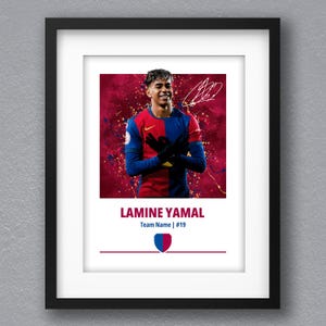 May include: A framed print of a soccer player in a red and blue jersey with a red background. The player is holding his hands together in front of him. The print includes the player's name, "LAMINE YAMAL", and the team name and number, "Team Name | #19".