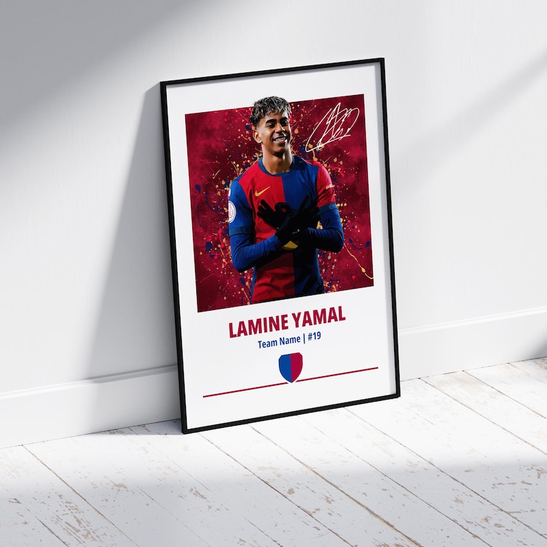 May include: A framed poster featuring a soccer player in a red and blue jersey with a red background. The player is holding his hands together in front of him. The poster includes the player's name, "LAMINE YAMAL", and the team name and number, "Team Name | #19".
