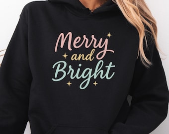 メリー＆ブライト クリスマス パーカー、レトロ パステル ホリデー プルオーバー（女性用）、快適な色合いの冬用フード付きスウェットシャツ、お祝いのクリスマスギフト
