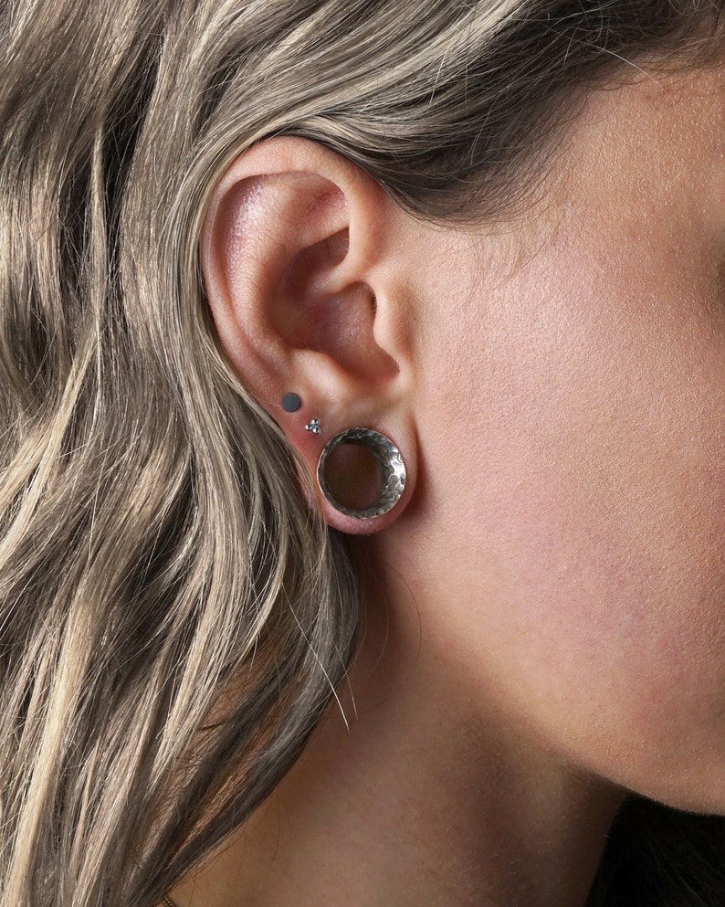 model wearing Hammered 925 Silver double flared ear tunnel