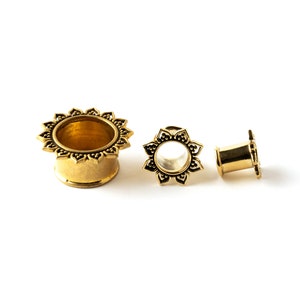 several sizes of Iriya golden lotus petals plug tunnels front and side view