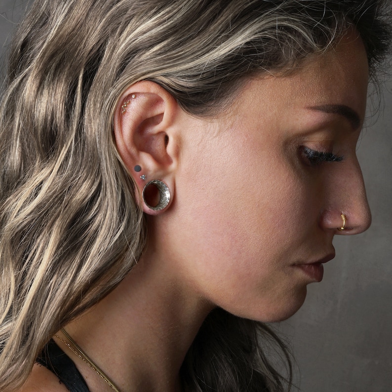 model wearing Hammered 925 Silver double flared ear tunnel