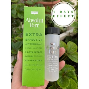 Op de afbeelding: Twee flessen Absolut Torr Extra Effectieve Anti-transpirant. De flessen zijn helder en hebben een wit etiket met groene accenten. Het etiket vermeldt "Absolut Torr Extra Effectieve Anti-transpirant" en "7 Dagen Effect". De flessen zijn 35 ml.