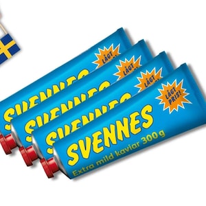 May include: Four blue tubes of Svennes extra mild caviar, each with a red cap. The tubes have yellow text and a starburst graphic that says "Lågt Pris!". A small Swedish flag is held in the upper left corner.