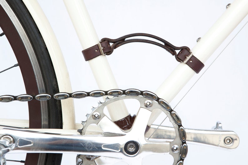 Close-up of dark brown leather "Little Lifter" bike handle on down tube and seat tube