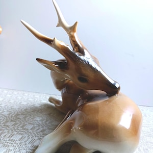 Vintage porcelain figurine of a DEER, produced ROYAL DUX, Czechoslovakia 1950s.Animal series.The statuette is undamaged.Hand-Painted.