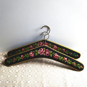 Charming Vintage Austrian Clothes Hanger 2 pcs.Handmade Tapestry embroidered Roses.A rare combination of Black color and a Gold Border.1960s