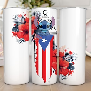 May include: White tumbler featuring a cartoon character, the Puerto Rican flag, and red hibiscus flowers. The design includes a blue cartoon character with large ears, a white star, and red and white stripes.