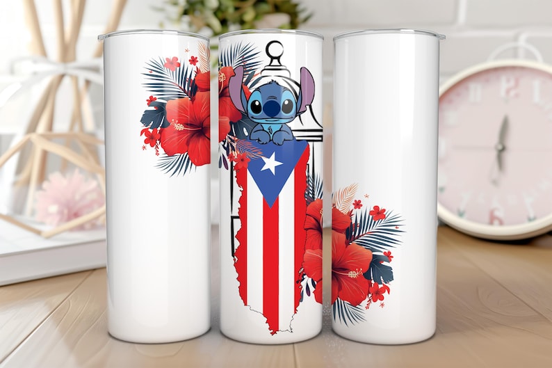 May include: White tumbler featuring a cartoon character, the Puerto Rican flag, and red hibiscus flowers. The design includes a blue cartoon character with large ears, a white star, and red and white stripes.