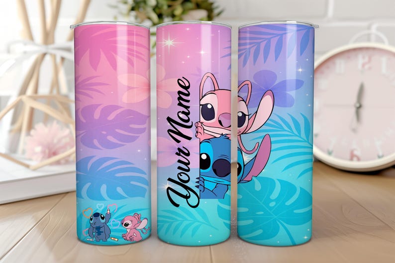 May include: Three 20 oz. stainless steel tumblers with a colorful design. The tumblers feature a gradient of pink, purple, and blue with tropical leaves and cartoon characters. One tumbler has the text "Your Name".
