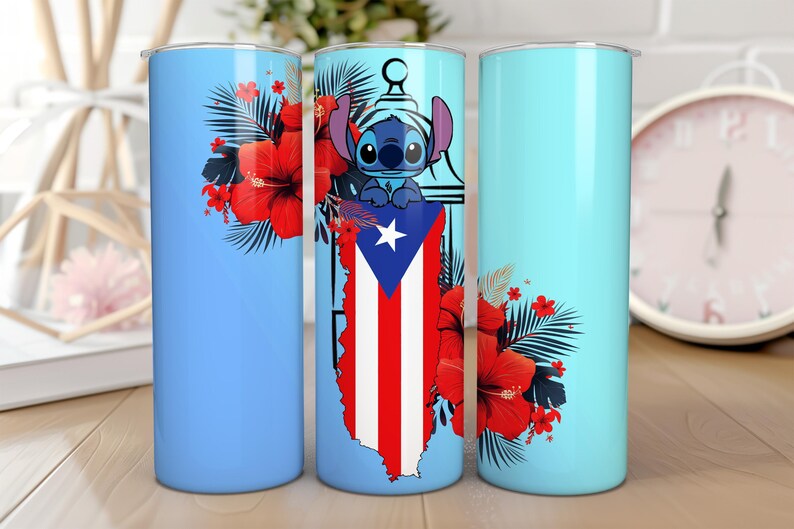 May include: A light blue tumbler featuring a design of Stitch, the Puerto Rican flag, and red hibiscus flowers. The tumbler has a cylindrical shape and is likely made of stainless steel. The design is repeated on the tumbler.
