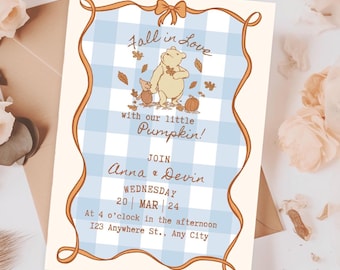 May include: An invitation with a light blue gingham background and an orange border. The text "Fall in Love with our little Pumpkin!" is displayed above the names Anna & Devin, and the date and time. Winnie the Pooh and Piglet are featured.