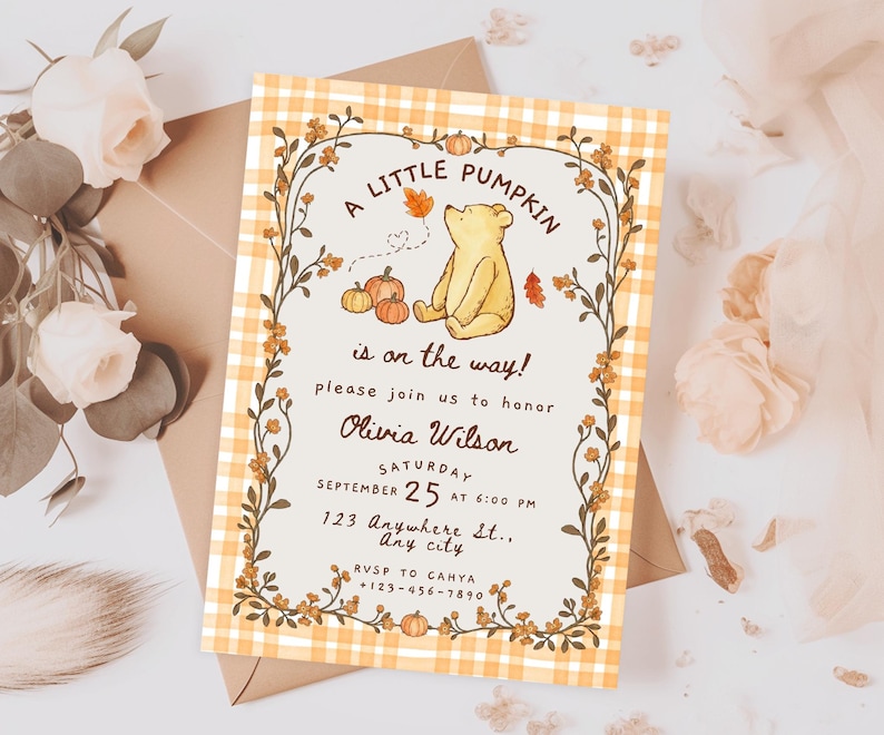 May include: A rectangular baby shower invitation card featuring a yellow and white gingham border, a central illustration of a yellow bear with pumpkins, and text reading A LITTLE PUMPKIN is on the way! honoring Olivia Wilson on September 25.