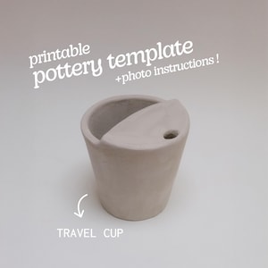 May include: A light beige travel cup with a distinctive design, including a curved lid with a small hole. The text "printable pottery template + photo instructions!" is at the top, and "TRAVEL CUP" is at the bottom.