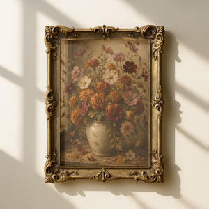 May include: A rectangular wall art piece featuring a floral still life painting of orange, pink, and white flowers in a light-colored ceramic vase, enclosed within an ornate, textured gold-toned frame with intricate scrollwork detailing.
