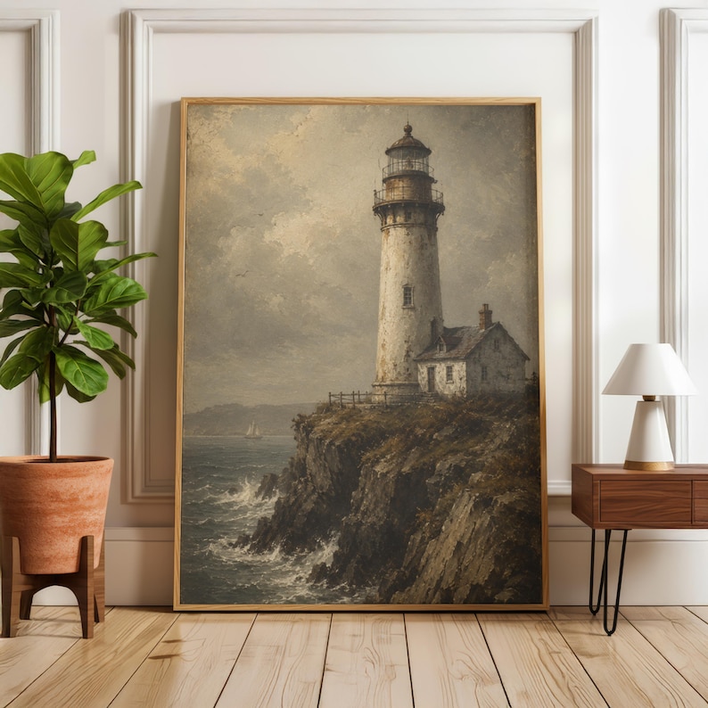 May include: A framed wall art print depicting a tall, weathered lighthouse standing on a rugged cliffside overlooking a turbulent ocean. The scene features muted, earthy tones, a cloudy sky, and a small sailboat visible on the distant horizon.