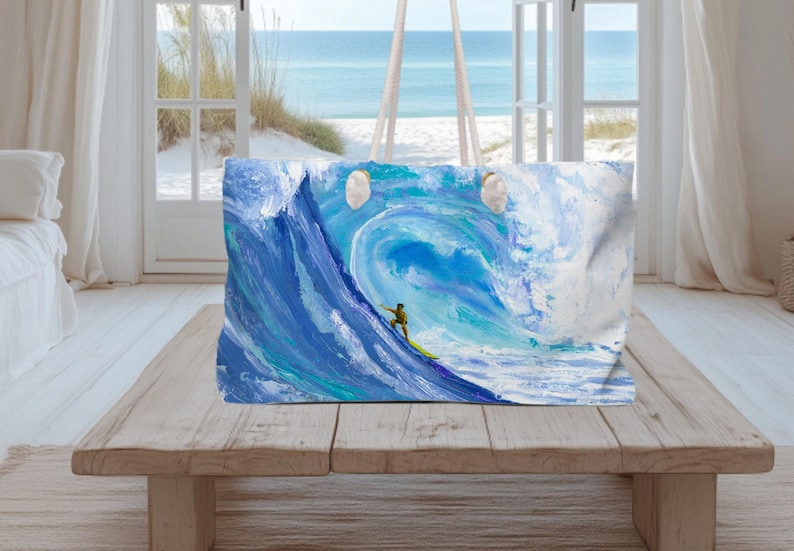 May include: A rectangular tote bag featuring a vibrant, painterly depiction of a large, curling ocean wave in shades of deep blue, turquoise, and white. A small figure on a yellow surfboard is positioned on the face of the wave.