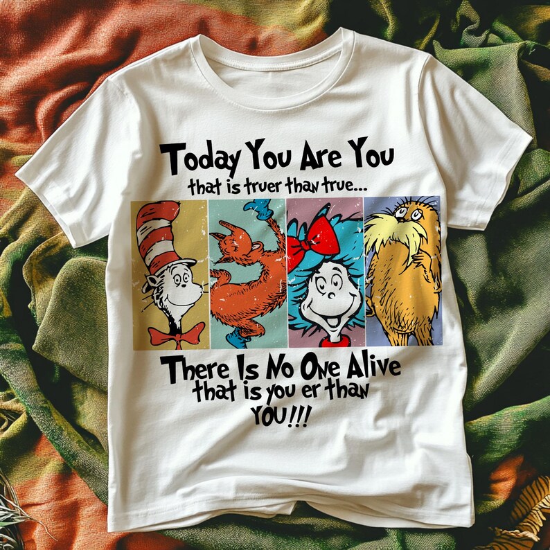 May include: White t-shirt featuring four cartoon characters in a rectangular design. The text "Today You Are You that is truer than true... There Is No One Alive that is you er than YOU!!!" is printed above and below the characters.