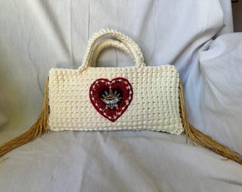 sacred heart crochet clutch with gold fringe