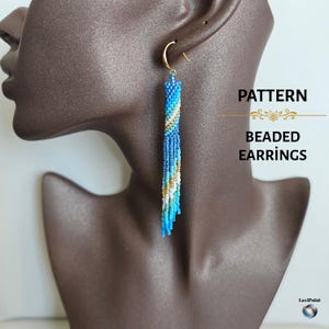 May include: Long beaded earrings in shades of blue, white, and gold hang from a gold-colored hook. The earrings are displayed on a brown mannequin head. The text "PATTERN BEADED EARRINGS" is visible.
