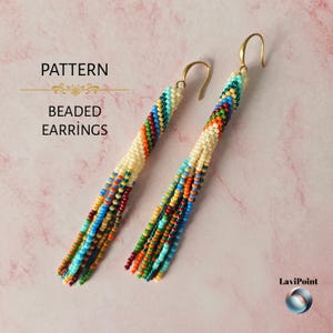 May include: Long, dangling beaded earrings featuring a multi-colored diagonal stripe pattern in shades of red, orange, yellow, green, blue, and cream. The earrings have gold-tone metal hooks and include the text PATTERN BEADED EARRINGS.