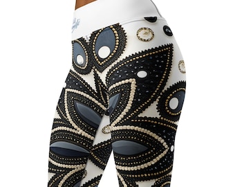 May include: White leggings with a black and gold floral pattern. The pattern features large, stylized flowers with intricate details.
