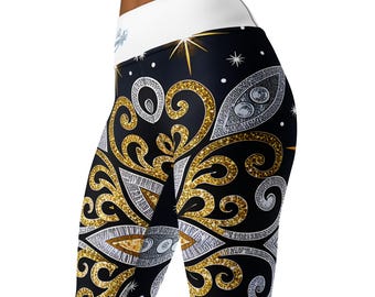 May include: Black leggings with a gold and silver glitter pattern. The pattern features a swirling design with a white waistband.