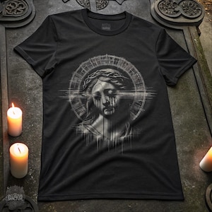 May include: Black t-shirt featuring a grayscale graphic of a weeping figure with a crown of thorns, surrounded by a halo. The design has a glitch effect. The text "OCCULTUS SANCTUM" is at the bottom.