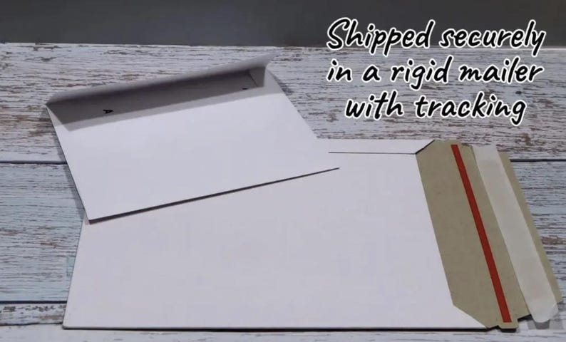 May include: Two white paper mailers, one smaller envelope with a flap and one larger rectangular rigid mailer featuring a brown cardboard edge and a red adhesive strip for sealing, presented as flat stationery supplies for mailing documents.