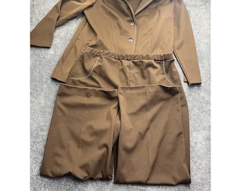 May include: A brown two-piece set consisting of a long-sleeved blazer and matching wide-leg trousers. The blazer features a notched collar, two front buttons, and white decorative stitching along the lapels. The trousers have an elastic waistband.