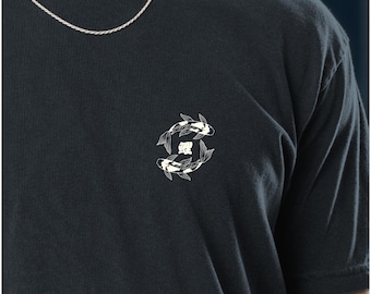 May include: Black t-shirt featuring a white and black koi fish design. The koi fish are arranged in a circular pattern, with a Japanese character in the center. The shirt has short sleeves and a crew neck.