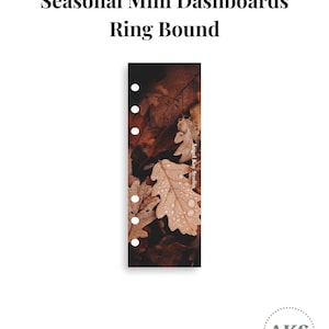 May include: A rectangular ring bound dashboard featuring a photographic print of brown autumn oak leaves covered in water droplets. The text Seasonal Mini Dashboards Ring Bound appears above the dashboard, and Angel Kay Studio is printed vertically.