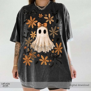 May include: Dark grey t-shirt with a ghost design, orange flowers, black bows, and spiders. The shirt has the text "digital download" and "infinite pixel studio".