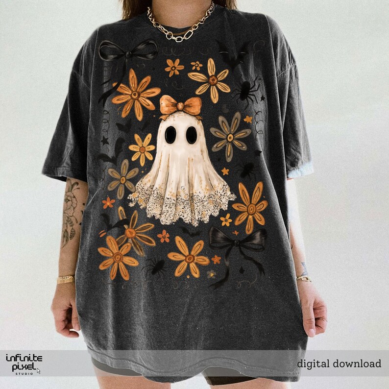 May include: Dark grey t-shirt with a ghost design, orange flowers, black bows, and spiders. The shirt has the text "digital download" and "infinite pixel studio".