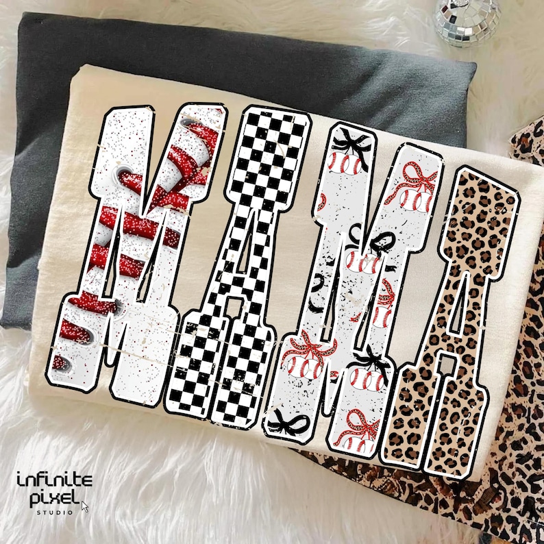 May include: A cream-coloured t-shirt displaying the word "MAMA" in a bold, outlined font. Each letter has a different design: candy cane stripes, a chequered pattern, baseballs with bows, and leopard print. The Infinite Pixel Studio logo is visible.