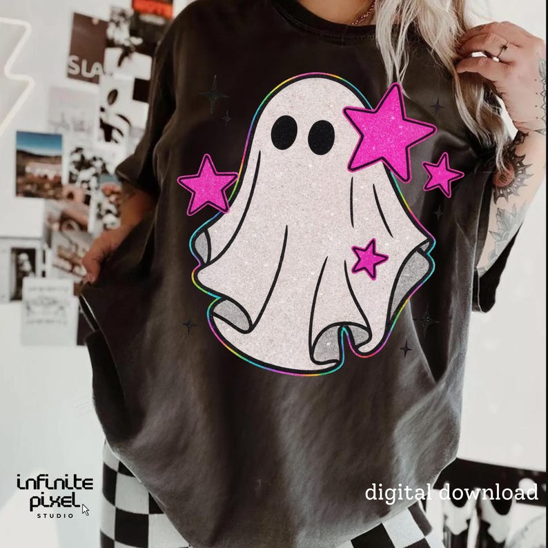 May include: Dark gray t-shirt featuring a white ghost design with pink stars and a rainbow outline. The shirt has the text "digital download" and the Infinite Pixel Studio logo.