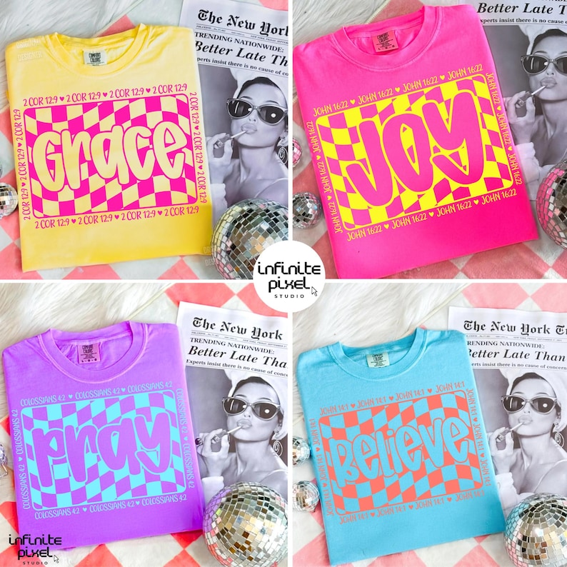 May include: Four colorful t-shirts with the words "Grace", "Joy", "Pray", and "Believe" in a retro font and checkered pattern. Each shirt has a different color: yellow, pink, purple, and blue. The shirts are displayed with a newspaper and disco ball.
