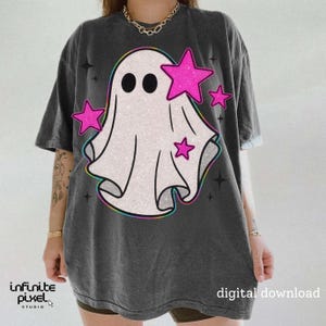 May include: Dark gray t-shirt featuring a white ghost design with black eyes and pink glitter stars. The ghost has a rainbow outline. The shirt has the text "digital download" on the bottom right.