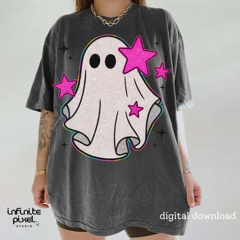 May include: Dark gray t-shirt featuring a white ghost design with black eyes and pink glitter stars. The ghost has a rainbow outline. The shirt has the text "digital download" on the bottom right.