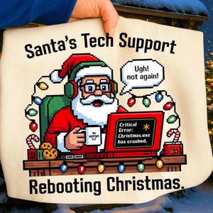 May include: A beige Christmas-themed graphic featuring Santa Claus in a red suit and hat, wearing headphones and looking at a laptop with a critical error message. Text reads "Santa's Tech Support" and "Rebooting Christmas."