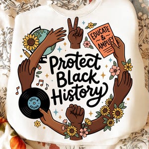 May include: White sweatshirt featuring the text "Protect Black History" in black script. The design includes hands, flowers, a globe, a record, and the text "Educate & Amplify".
