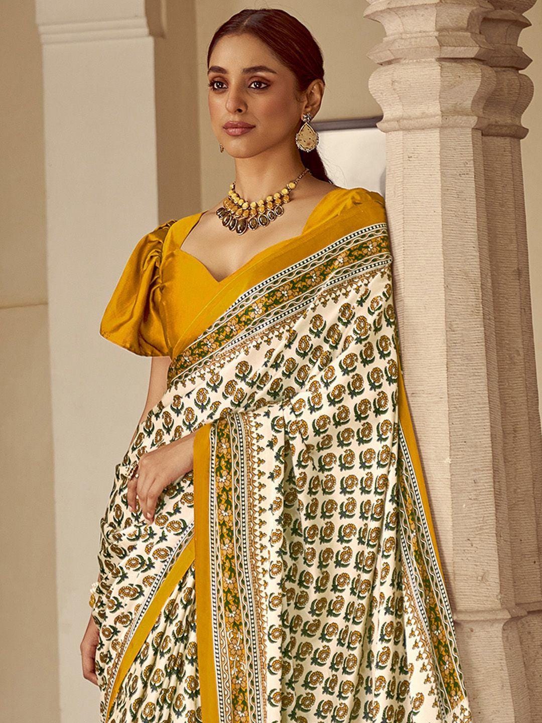 Mustard Ajrak print saree with embroidery highlightment paired with full sleeves blouse